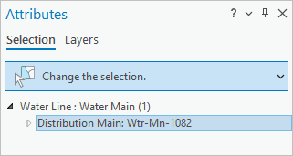 Selected feature described as Distribution Main: Wtr-Mn-1082 in the Attributes pane