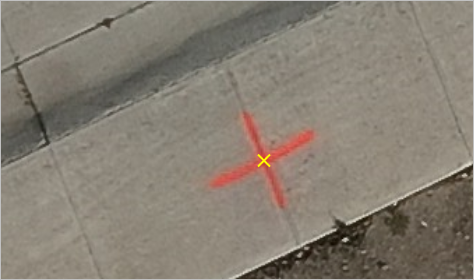Yellow image link marker in center of red marker on sidewalk