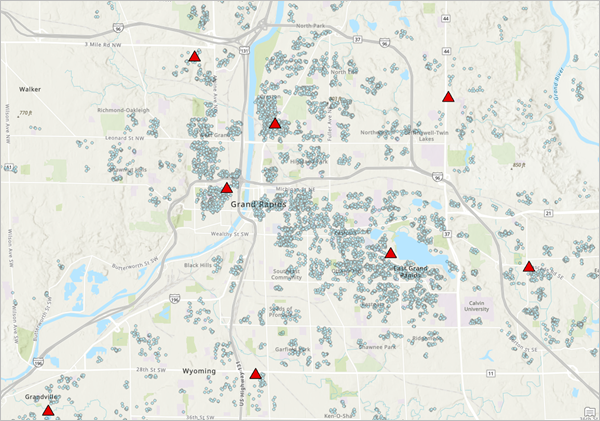 Map pane displaying Facilities features and customer features in Grand Rapids, Michigan.