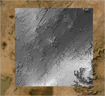 衛星画像ベースマップの上に表示された白黒の陰影起伏